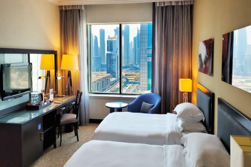 towers rotana hotel dubai - guest room twin beds