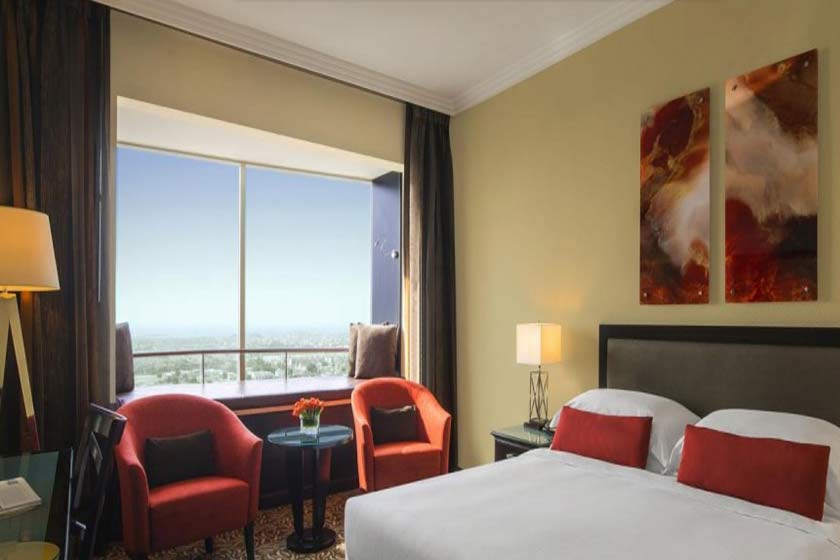 towers rotana hotel dubai - window seat view room king bed