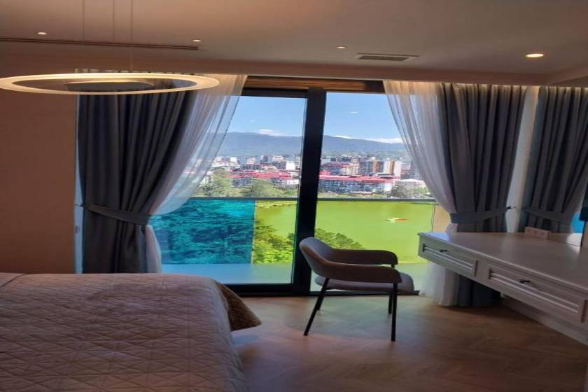 Beachfront Bellevue Residence Suites - Three-Bedroom Apartment with Lake View