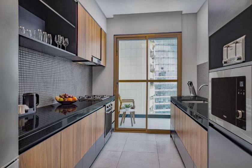 DoubleTree by Hilton Dubai M Square Hotel & Residences - Four-Bedroom Apartment with Kitchen and Balcony